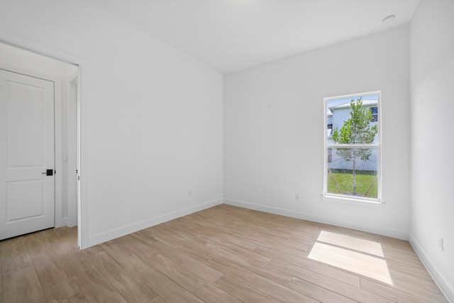 unfurnished room with a wealth of natural light and light wood-type flooring