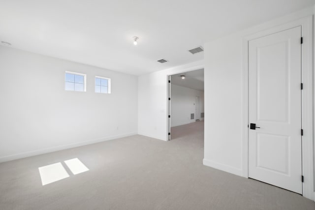 spare room featuring carpet floors