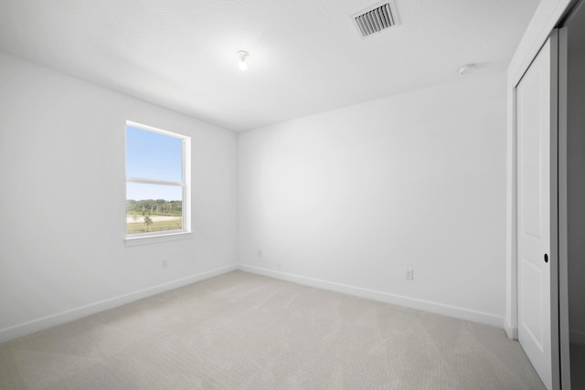 unfurnished room with carpet flooring