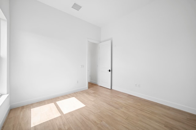 spare room featuring light hardwood / wood-style flooring