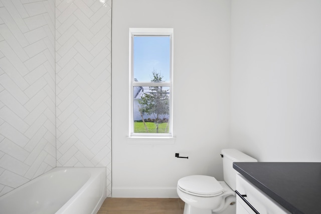 bathroom featuring wood-type flooring, vanity, and toilet