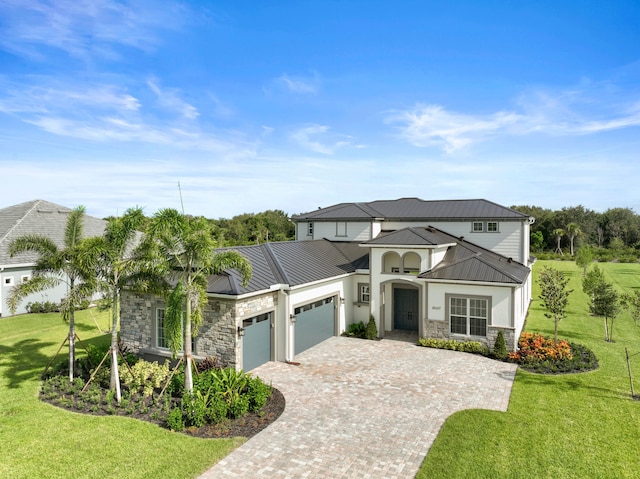 view of front facade with a garage and a front yard