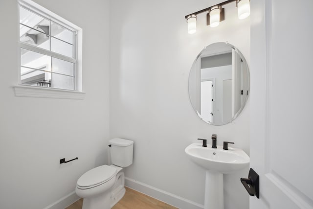 bathroom featuring toilet and hardwood / wood-style floors