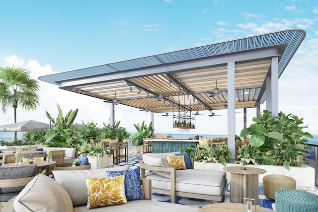 view of terrace with exterior bar, outdoor lounge area, and ceiling fan