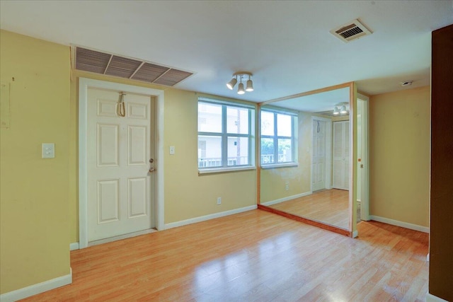 spare room with light hardwood / wood-style flooring