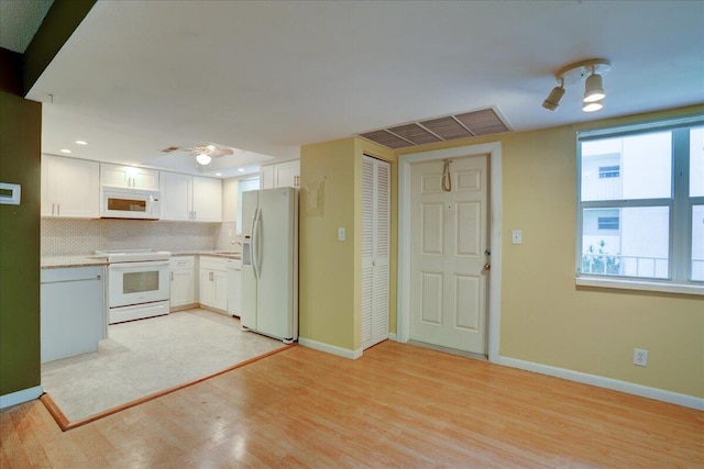 kitchen with ceiling fan, light wood-type flooring, and white appliances