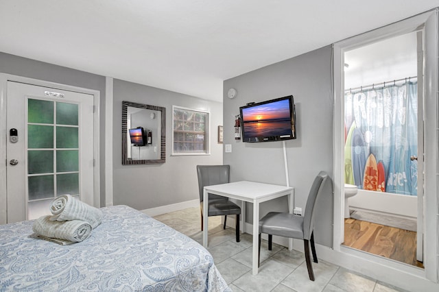 bedroom featuring light tile flooring