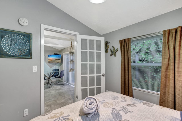 tiled bedroom featuring vaulted ceiling