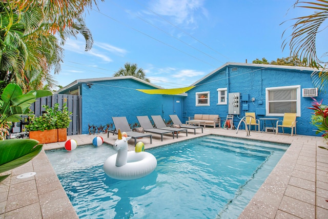 view of swimming pool featuring an outdoor living space and a patio