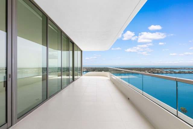 balcony featuring a water view