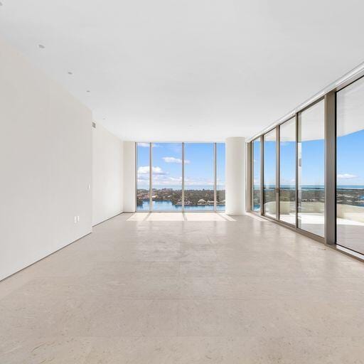 empty room featuring floor to ceiling windows