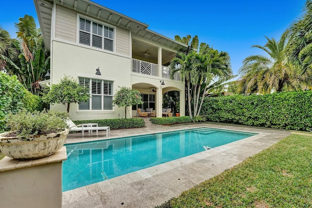 view of swimming pool featuring a patio area