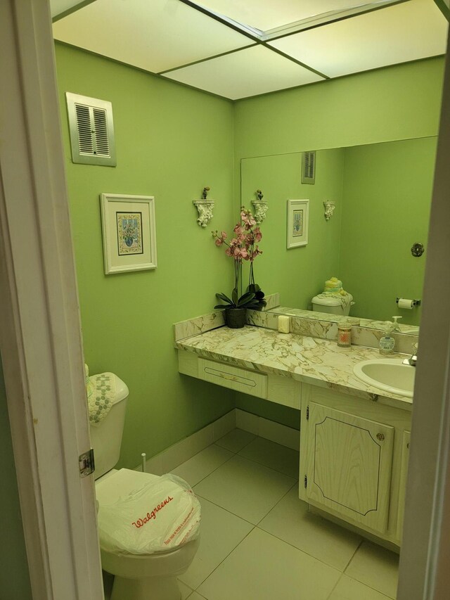 tiled bedroom with a closet and ceiling fan