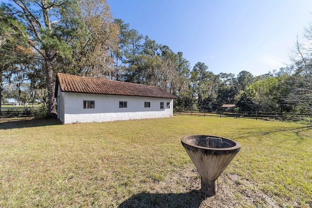 view of yard with an outdoor fire pit