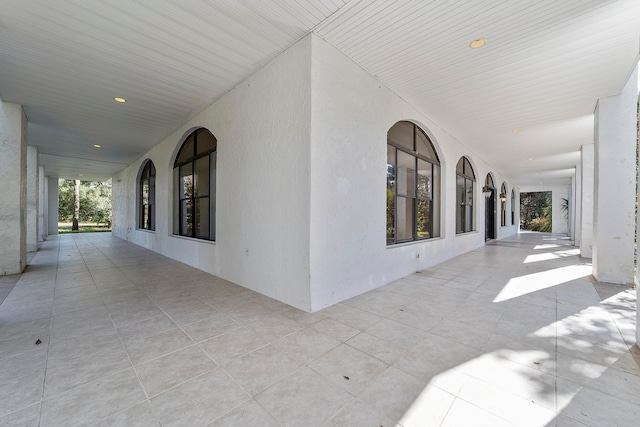 hall featuring light tile floors