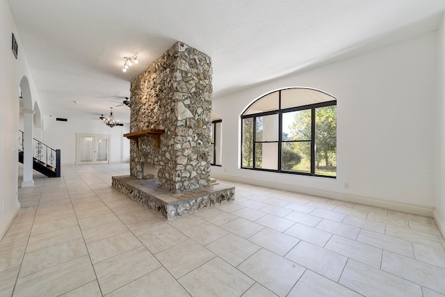 interior space with a chandelier and light tile floors