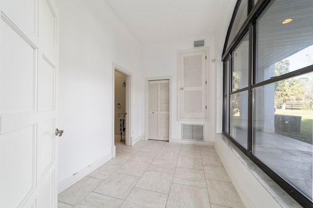 empty room with light tile floors