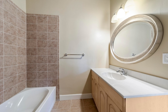 bathroom featuring tiled shower / bath combo, tile floors, and vanity