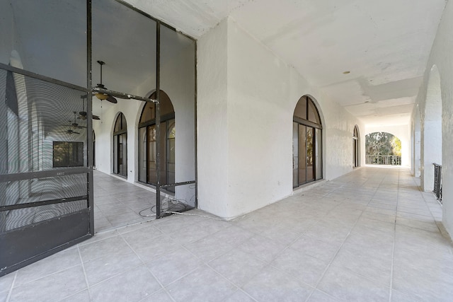 hallway featuring light tile floors