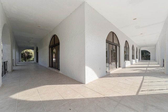 hall with light tile flooring