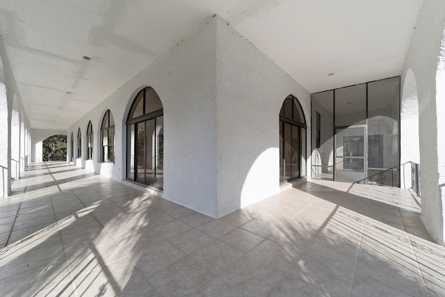 corridor featuring light tile flooring