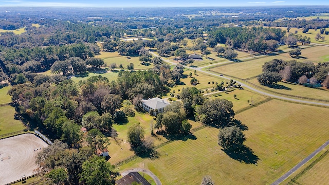 birds eye view of property featuring a rural view