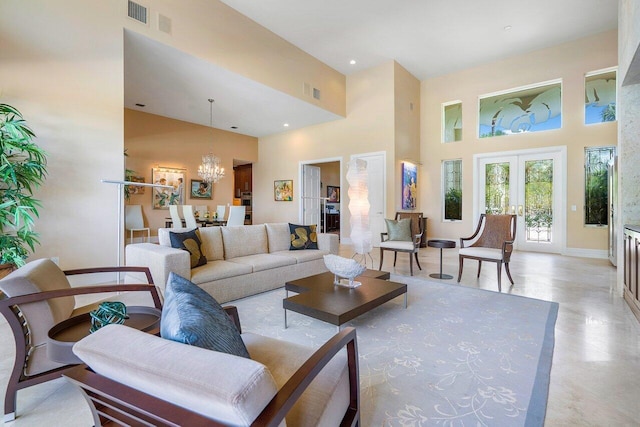 living room featuring a chandelier, a high ceiling, and french doors