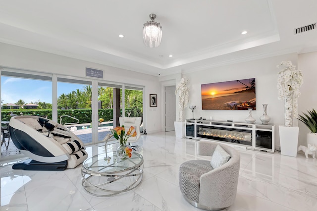 living room featuring a raised ceiling, light tile flooring, and a notable chandelier