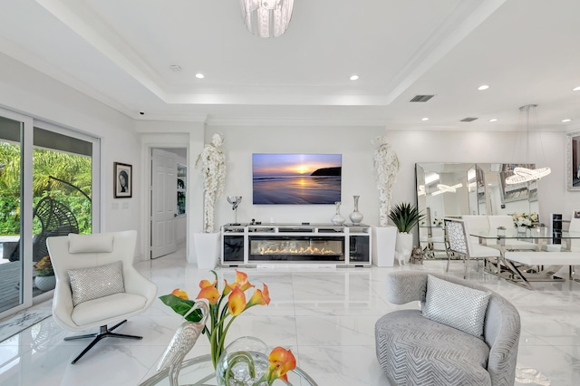 living room with a tray ceiling, a notable chandelier, and light tile floors