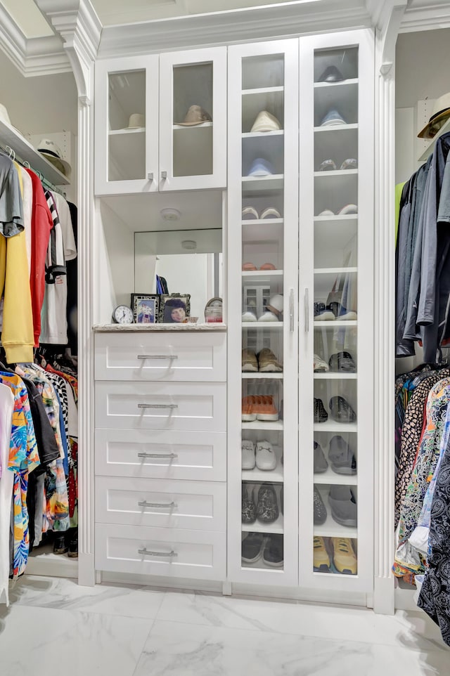 spacious closet featuring light tile flooring