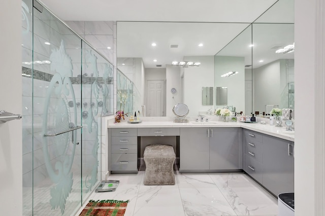 bathroom with an enclosed shower, vanity, and tile floors