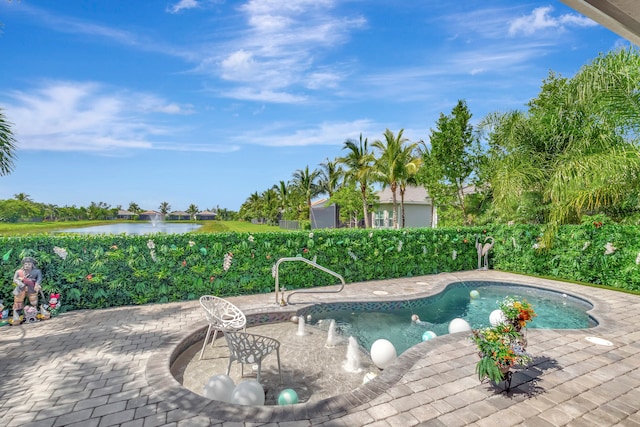 view of swimming pool with a patio area