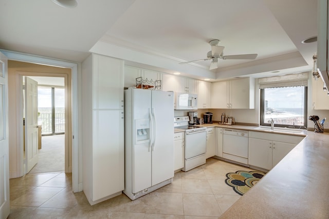 kitchen with white cabinets, light tile floors, ceiling fan, and white appliances