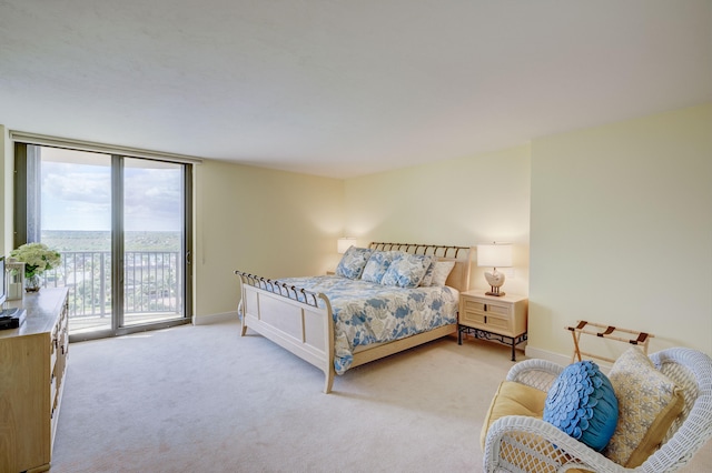 carpeted bedroom featuring access to exterior