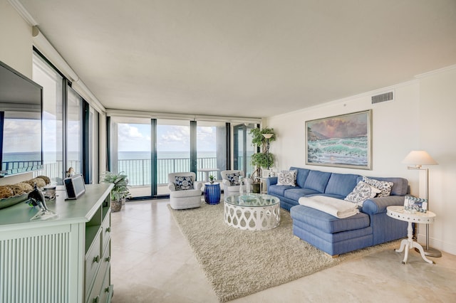 tiled living room with floor to ceiling windows, a water view, and ornamental molding