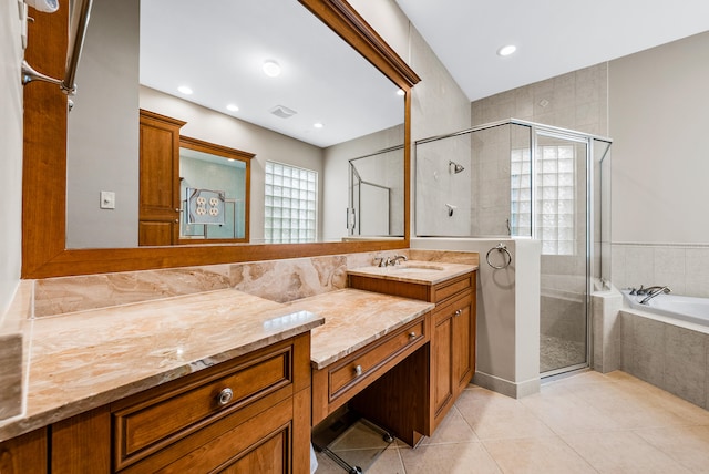 bathroom with tile flooring, plus walk in shower, and vanity