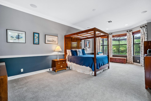 carpeted bedroom featuring crown molding