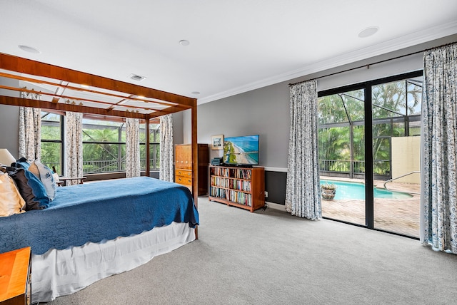 carpeted bedroom featuring multiple windows, crown molding, and access to exterior