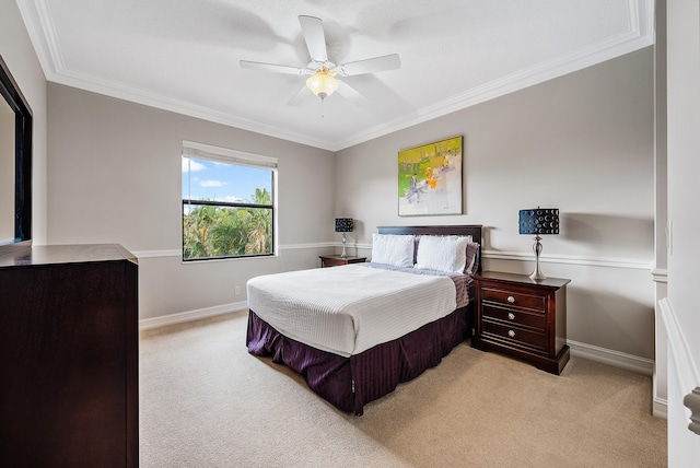 carpeted bedroom with crown molding and ceiling fan