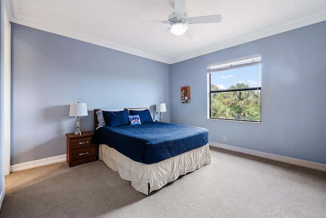 carpeted bedroom featuring ceiling fan and ornamental molding