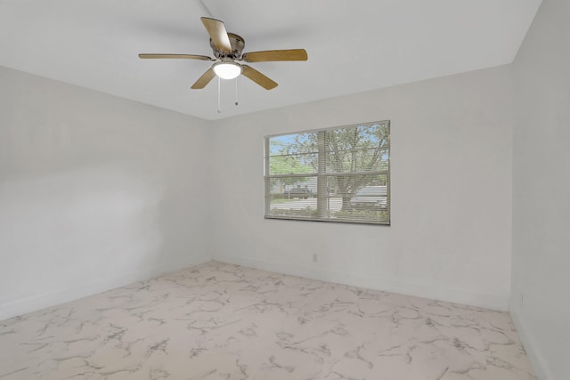 unfurnished room with ceiling fan and light tile floors