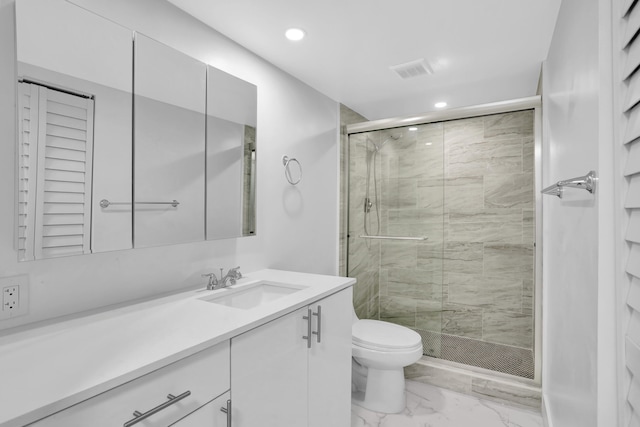 bathroom featuring toilet, tile flooring, a shower with shower door, and vanity