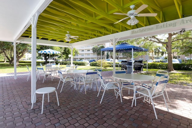 view of terrace with a gazebo and ceiling fan