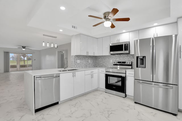 kitchen featuring white cabinets, appliances with stainless steel finishes, sink, and light tile floors