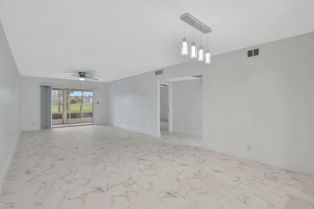 empty room featuring light tile floors and ceiling fan with notable chandelier