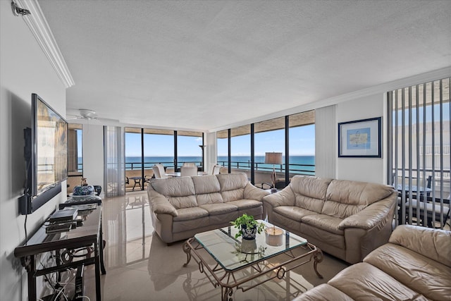 tiled living room with a textured ceiling, crown molding, and a water view