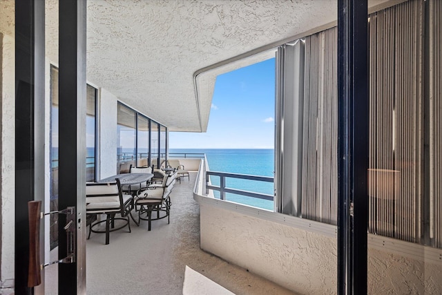 balcony featuring a water view