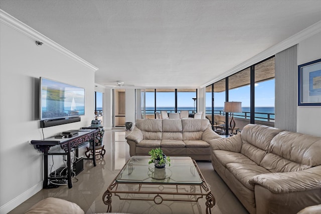 living room featuring a water view, light tile floors, a textured ceiling, and crown molding