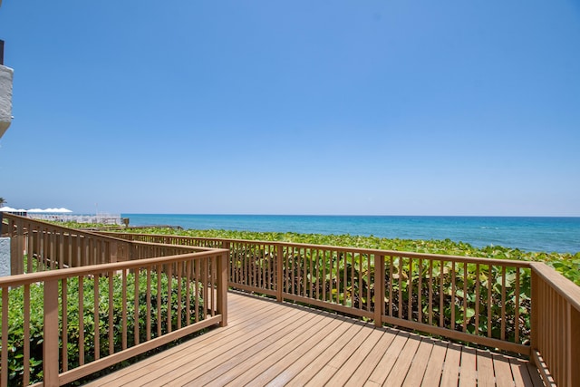 wooden deck with a water view