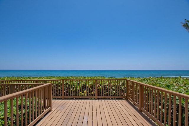 wooden deck featuring a water view